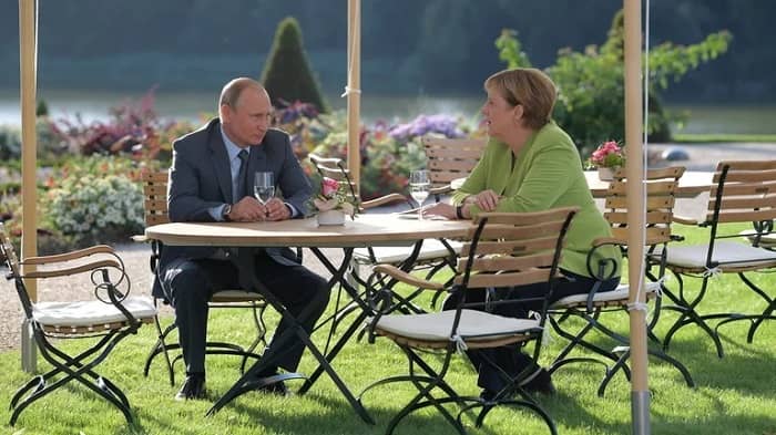 Putin y Merkel,